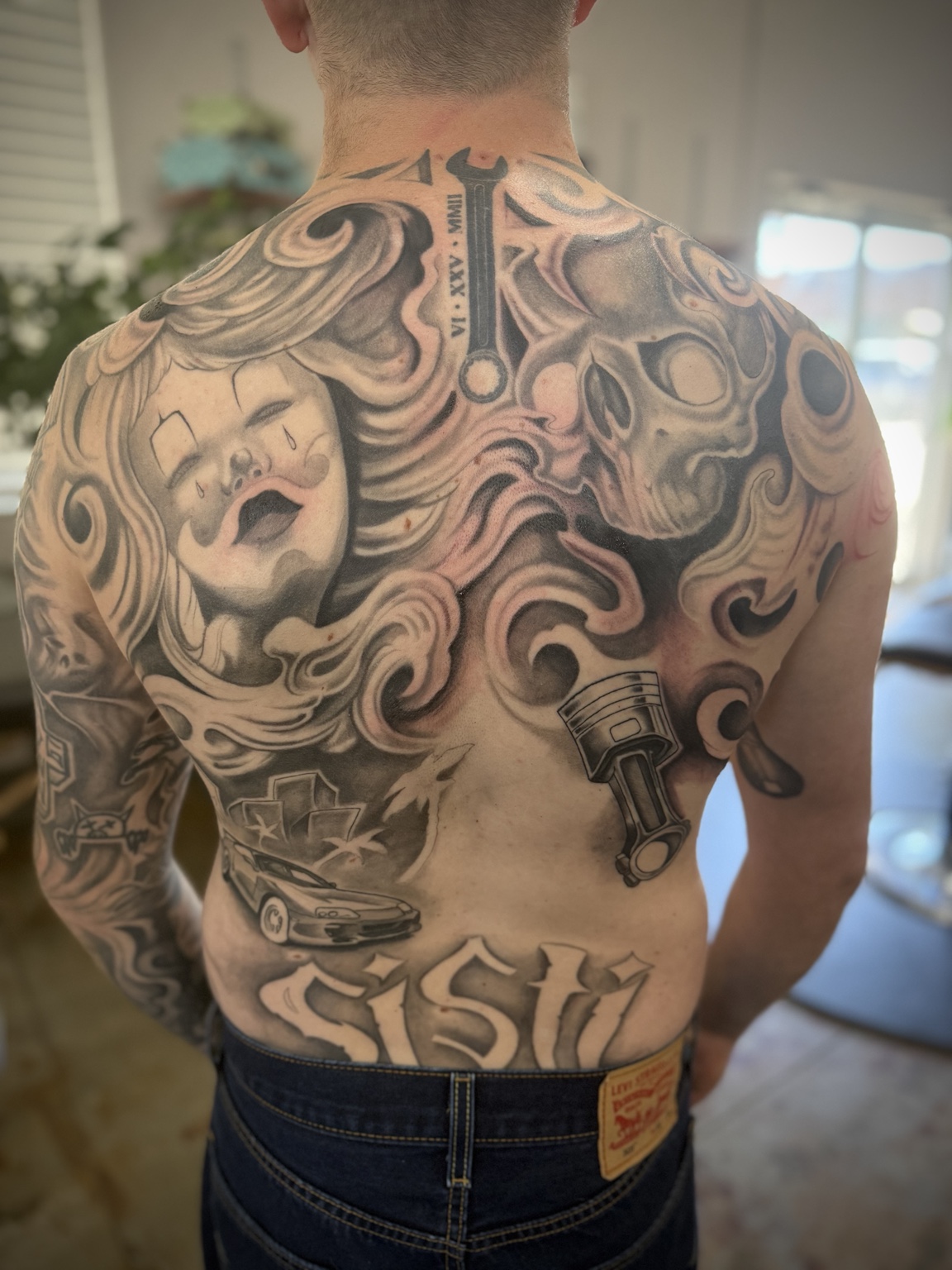 Black and gray tattoo work by Michael