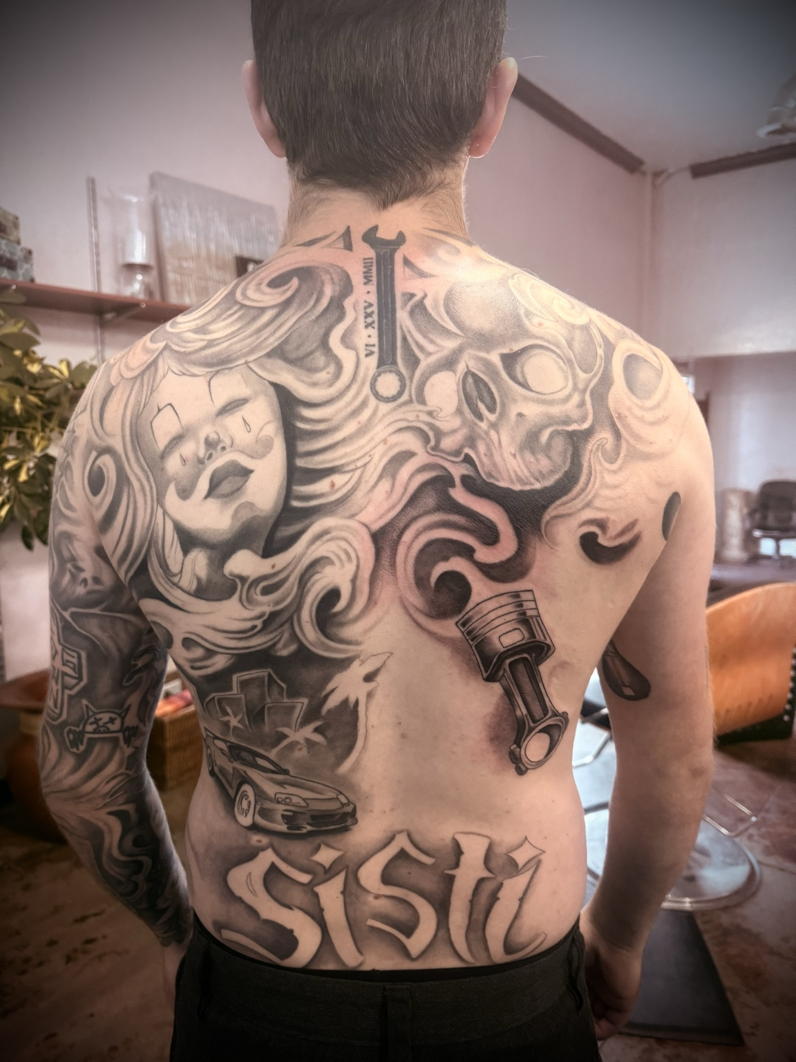 Large custom black-and-gray back piece in progress