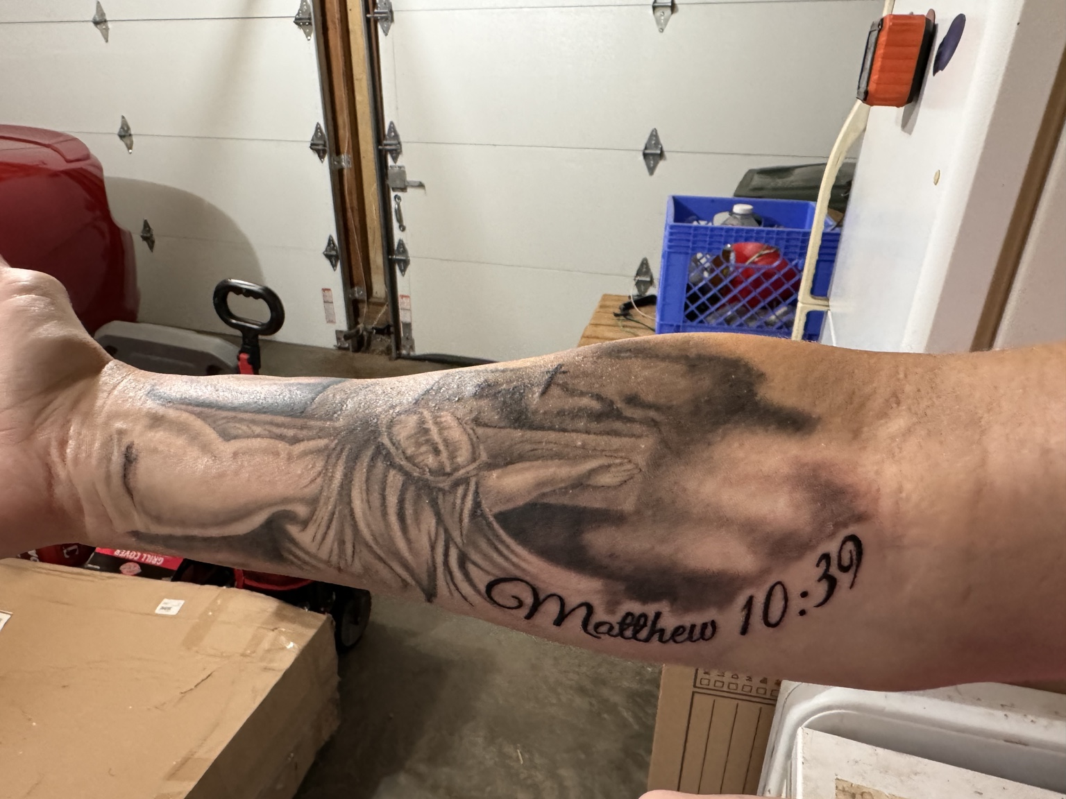 Matthew 10:39 black-and-gray forearm tattoo